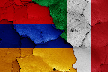 flags of Armenia and Italy painted on cracked wall