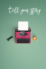 vintage typewriter with hot coffee cup on the color background