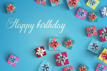 Happy birthday and gift box on color background