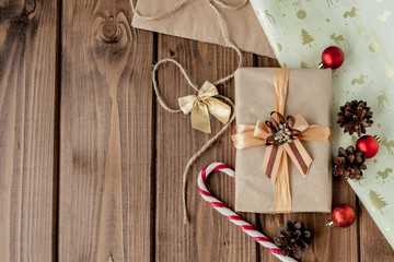 Christmas presents with ribbon on dark wooden background in vintage style