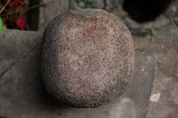 Photo of a single, small stone at home