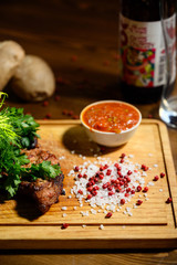 Sliced meat. Grilled beef steak on wooden cutting board. Grilled meat.