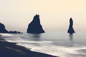 Reynisdrangar sea-stacks at Kirkjufjara beach in Iceland