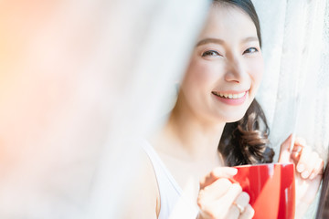 beauty charming asian woman casual dress enjoy morning coffee near window bedroom background