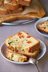 Slices of cake with candied fruit on a white plate