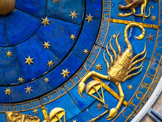 Scorpio astrological sign on ancient clock. Detail of Zodiac wheel with scorpion.