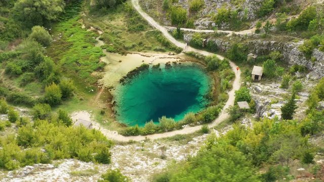 Croatia, Cetina river source water hole in Dalmatian Zagora, aerial drone view