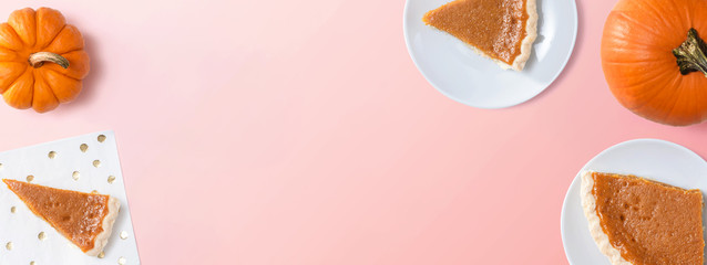 Pumpkin pie with autumn pumpkins - overhead view