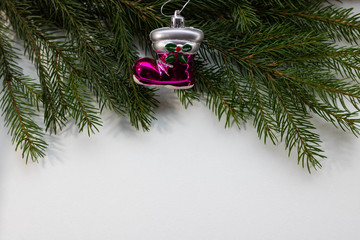 Toys on spruce branches. Christmas tree decorations and decorations in the design.2020