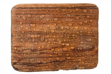 Beautiful raindrops on an old wooden surface. Isolated on white background.