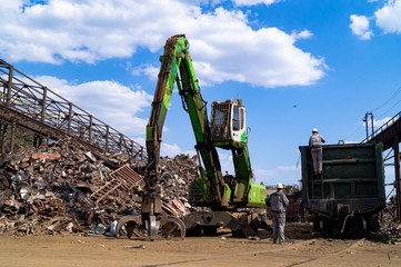  Dnipro, Dnepropetrovsk region / Ukraine - 01/10/2019; Loading scrap metal into wagons with a...