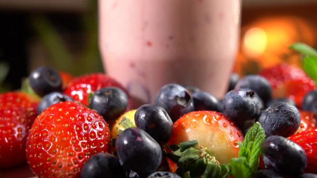 Healthy vegan fresh strawberry smoothie, 2in1. Glass with strawberry yoghurt, blackberry beverage and vitamins complex. Vegan food concept