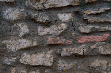 old stone wall outdoors for background, texture