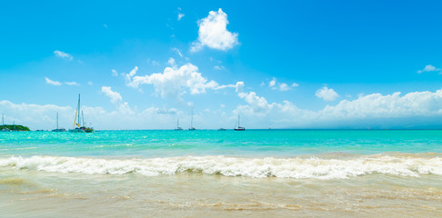 Fototapeta na wymiar Boats in La Datcha beach in Guadeloupe