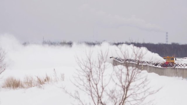 Snowplow clears the runway