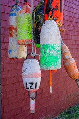 View of colorful lobster trap market buoys in Lunenburg, Nova Scotia, Canada