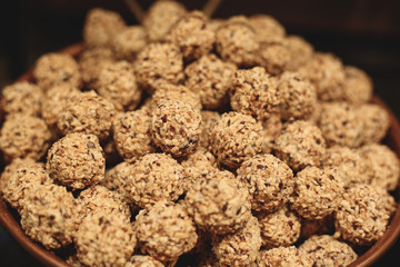 A bowl full of brown belgian patisserie pralines