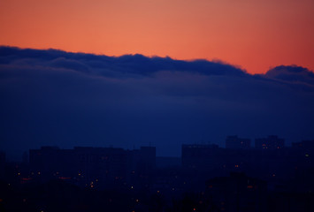 dark blue clouds  before the storm over the city