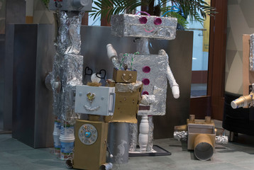 toy robots made of tinfoil and paperboard