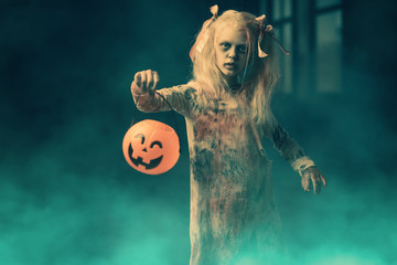 bloody girl with a pumpkin