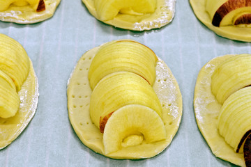 Apple tartlets in preparation on confectionery