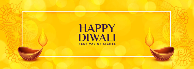yellow diwali banner with two diya design