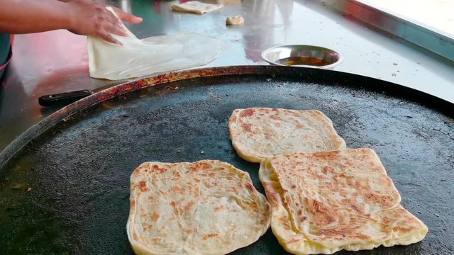 Clips of Roti Parata or Roti canai in the making process.