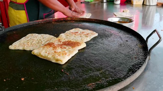 Clips of Roti Parata or Roti canai in the making process.
