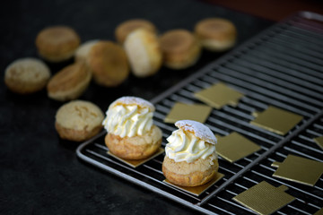Profiteroles in preparation on the countertop