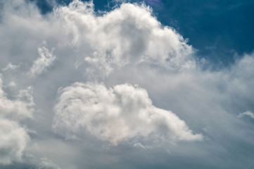 Clouds in the bright sky in the summer. Colorful cloud for background and postcard. Abstract color. Selective focus