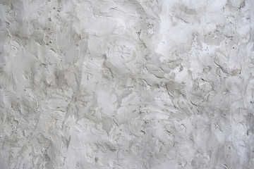 Plot of wall covered with rough plaster. Abstract background  for design.  