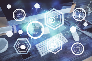 Computer on desktop with social network theme icon. Multi exposure. Concept of international connections.