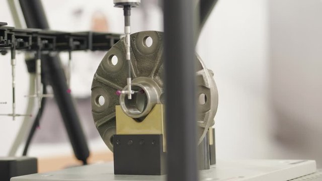Probe arm with high speed comparative gauge automatically inspecting detail. Automatic inspection of manufactured part by stylus ball. Gauging system. Module system with 3-axis analogue scanning probe