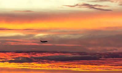 Fototapeta na wymiar Landing in beautiful Sunset