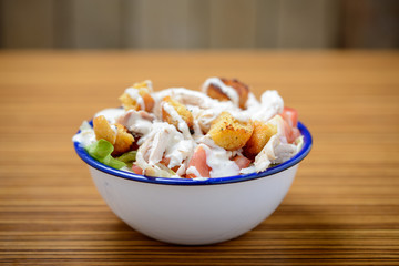 Close up of chicken salad in a bowl on a table