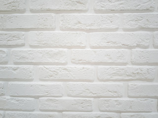 White wall made of decorative stylish brick. Concept of interior. Background image, place for text.