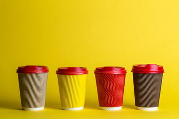 a lot of coffee in paper cups