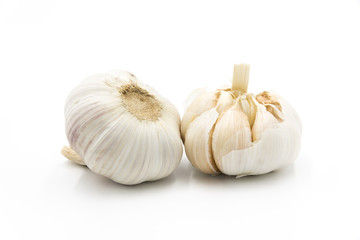 2 whole fresh garlic close-up isolated on white background