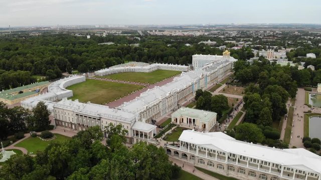 aerial view to Catherine Palace (Yekaterininskiy dvorets)  in Tsarskoye Selo (Pushkin) flying over at cloudy weather 