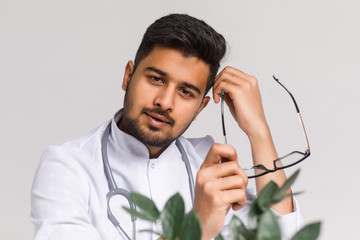 Young Doctor on the job. Volunteer at the hospital gains practical knowledge in treating disease.