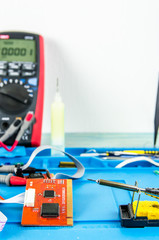 Fototapeta premium The electrician's workplace. Schemes, soldering iron. Electronics