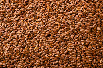 Flax seeds background. The view of the top.