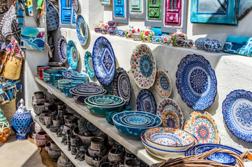 Oia, Santorini / Greece - 09.05.2018: Greek decorated handmade souvenir plates in a shop