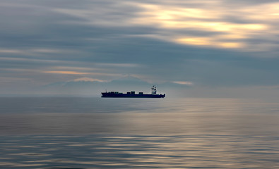 Container ship traveling on Aegean sea. Greece.