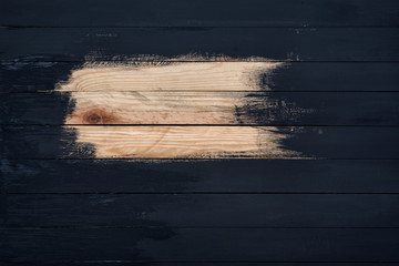 Not fully painted wooden boards in black. Place for text. Work in progress