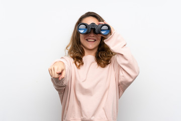 Young blonde woman with black binoculars