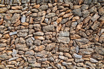 Wall of broken natural stones