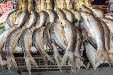 Chon Buri, Thailand - March 16, 2019: Nong Mon market. Closeup of large pile of gray-white long fishes on display at booth.