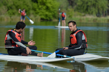 stand up paddle board couple paddleboarding