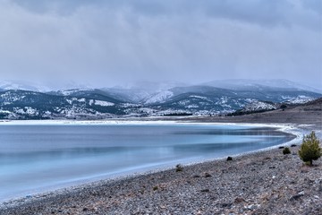 Beautiful winter landscape scene of a snowy lake at winter, Salda Lake, Turkey